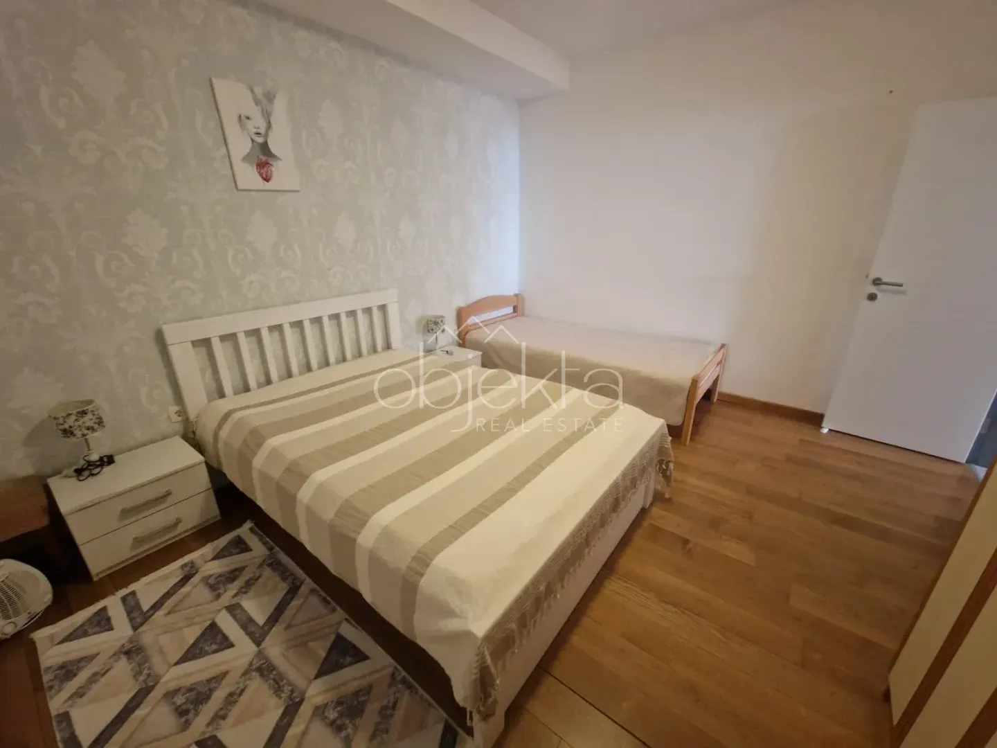 Bedroom with a double bed and an additional single bed.