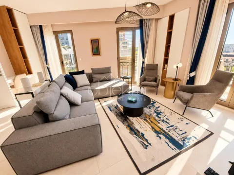 Spacious living room with a sofa set, armchairs, and access to the terrace. - image 5