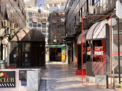Exterior of a commercial space in a building passage. - image 14