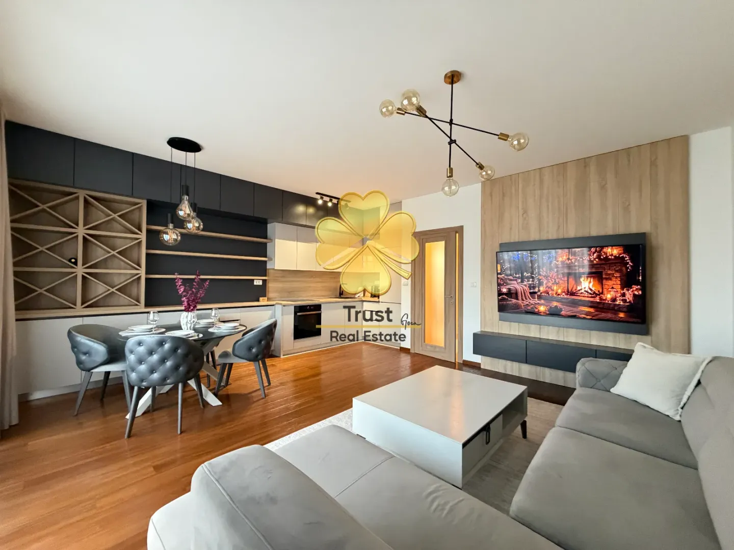 Modern and spacious open-plan living room with dining area and kitchen.