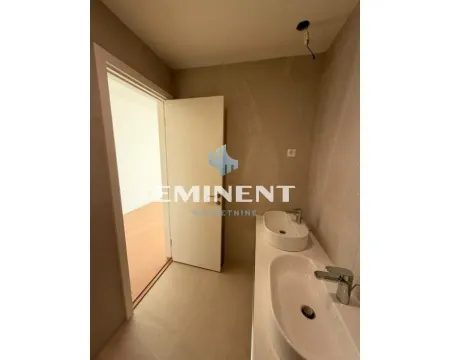 Bathroom with two washbasins and a view of the hallway through the open door. - image 6