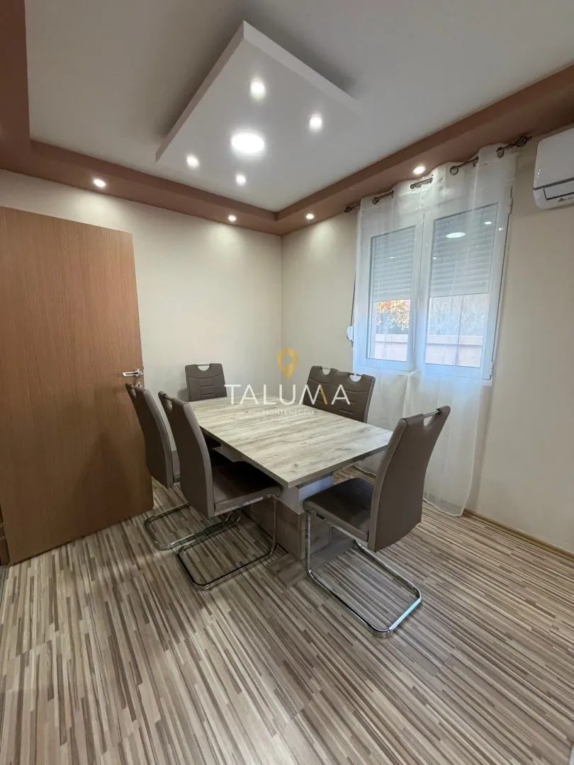 Dining area with a table and chairs.