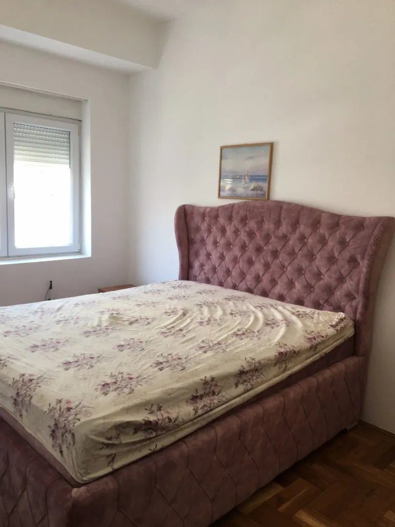 Bright bedroom with a large double bed.