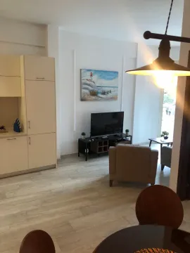Living room connected to the dining area and kitchen. - image 11