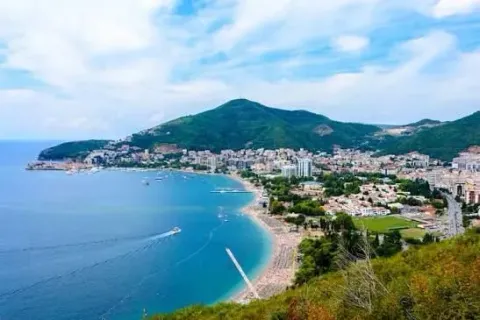 Panoramic view of the coastline, town, and sea from a terrace or elevated location. - image 2