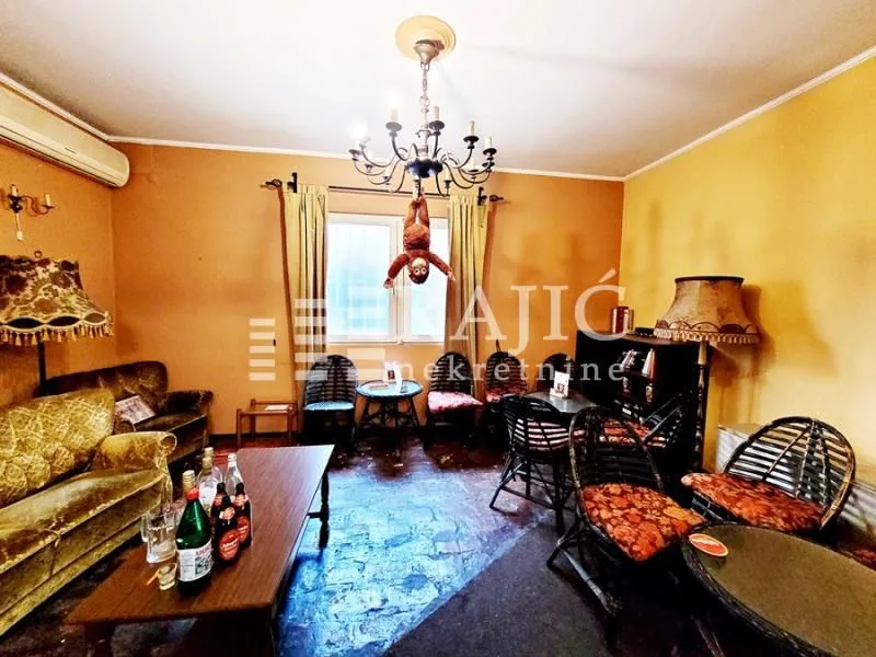 Living room with a sofa set and a dining table.