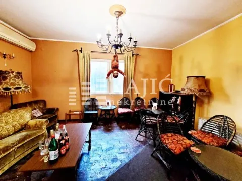 Living room with a sofa set and a dining table. - image 12