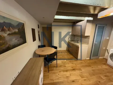 Smaller kitchen with a dining table and chairs. - image 2