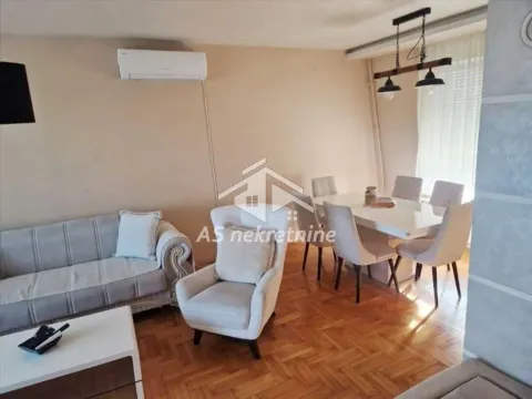 Living room with sofa, armchair and dining table. - image 2