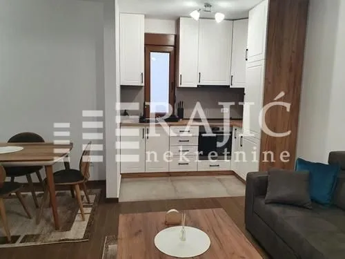 Living room with dining area and kitchen.