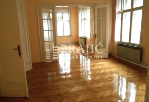 Empty room with parquet flooring and double glass doors. - image 2