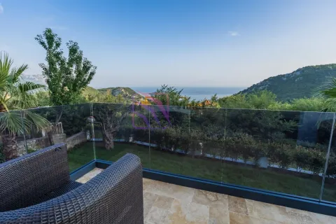 Terrace with a glass railing and a view of the sea and nature. - image 21