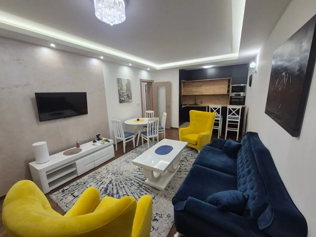Spacious living room connected to the dining area and kitchen.