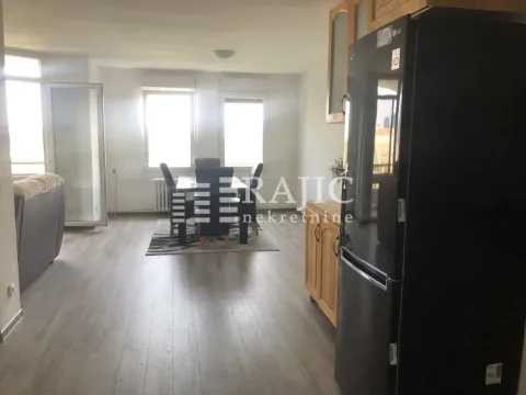 Living room with dining area and kitchen in the background. - image 5