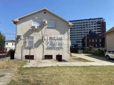 View of the rear side of the house with a yard. - image 18