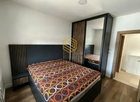 Modern bedroom with a double bed and a fitted wardrobe. - image 10