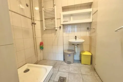Tiled bathroom with a shower tray and a washbasin. - image 9