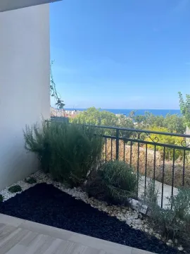 Terrace with a view of the sea and greenery. - image 3