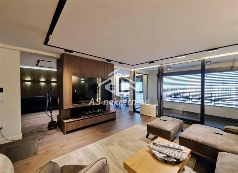 Modern living room with seating set and TV cabinet.