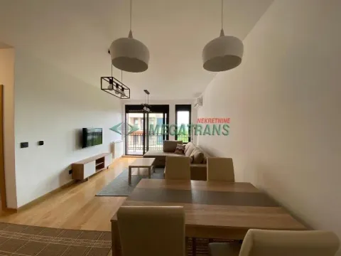 Spacious living room with dining area and access to the terrace. - image 2