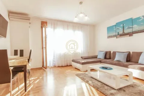 Living room with a sofa set, dining table and access to the terrace. - image 2