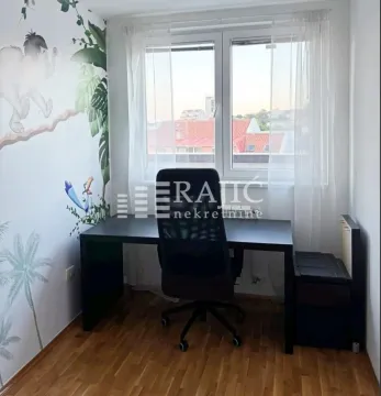 Children's room with a desk and jungle-themed wallpaper. - image 4