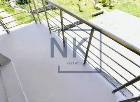 Tiled balcony with metal railing and a view of the courtyard. - image 6