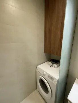 Bathroom with a washing machine and built-in cabinet. - image 9
