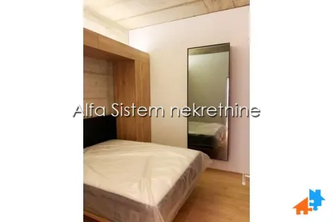 Bedroom with a double bed and a mirror. - image 8