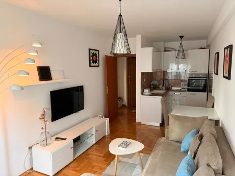 Living room connected to the dining area and kitchen. - image 3
