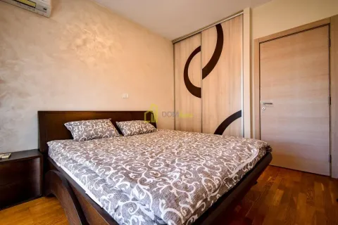 Furnished bedroom with a double bed, fitted wardrobe and parquet flooring. - image 23