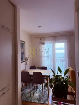 Dining area with a table, chairs, and access to the terrace. - image 4