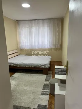Bedroom with a bed and a window. - image 4