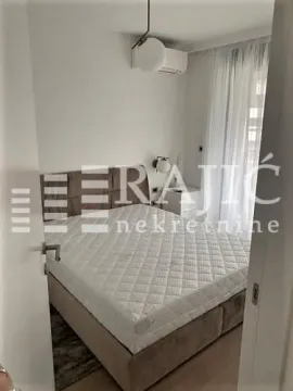 Furnished bedroom with a double bed. - image 3
