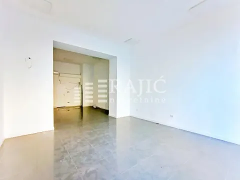 Empty bright room with white walls and tiled floors. - image 4
