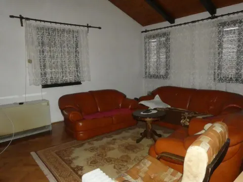 Living room with leather furniture and wooden ceiling. - image 14