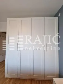 Large white wardrobe in the bedroom. - image 13