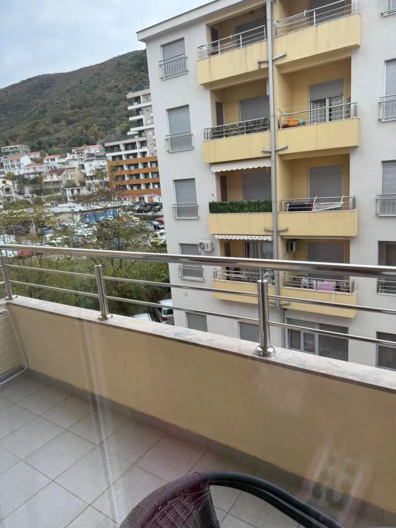View from the balcony overlooking the adjacent building and surrounding neighborhood.