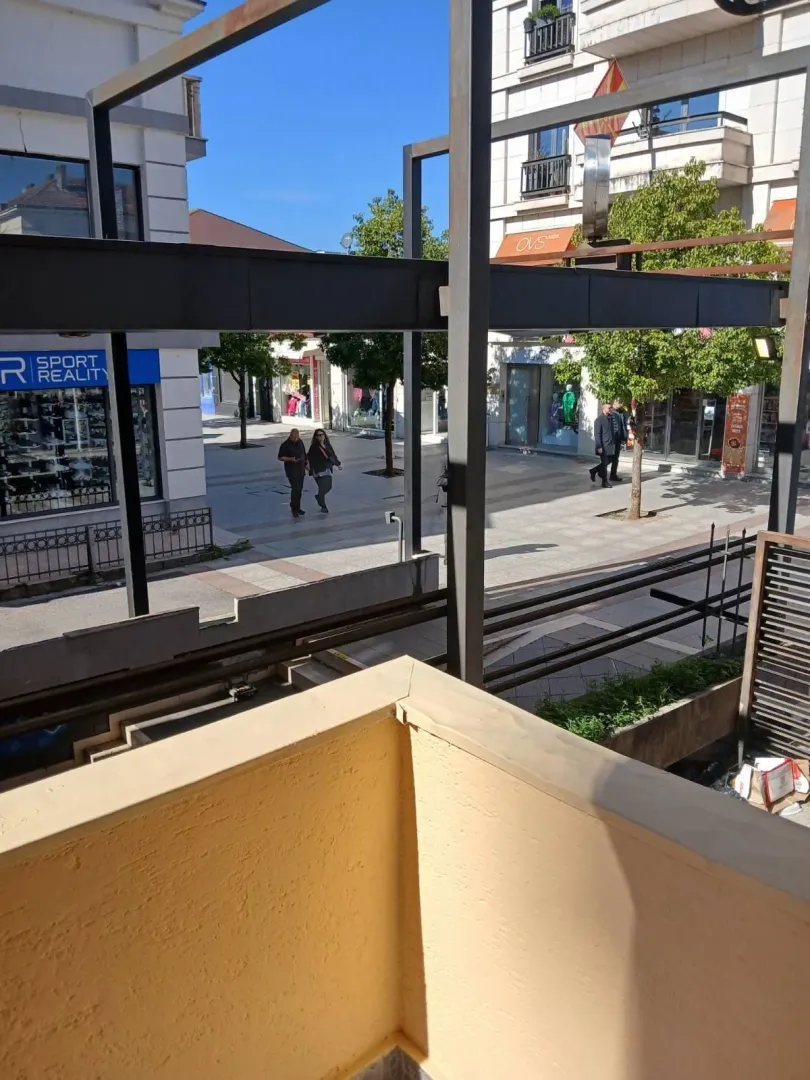 View from the balcony overlooking a city pedestrian zone.