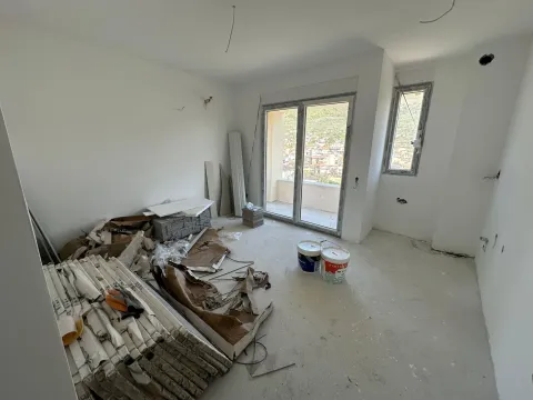Unfinished room under construction with building materials and access to the terrace. - image 6