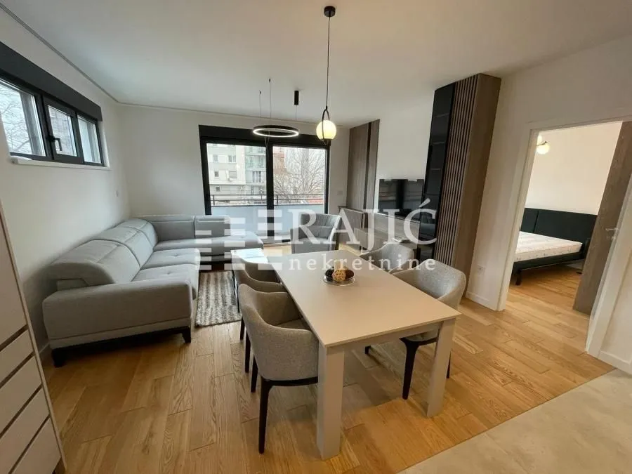 Living room with dining area in a modern apartment.