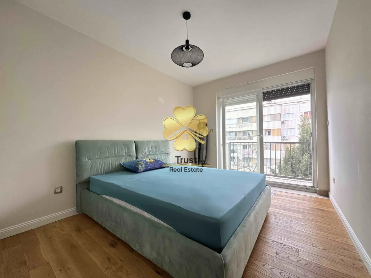 Bedroom with a double bed and balcony access.
