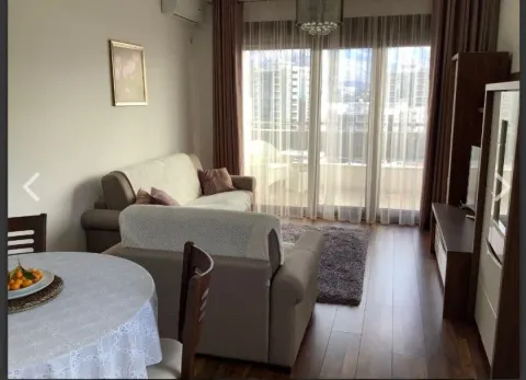 Living room with sofa set, dining table and access to the terrace. - image 9