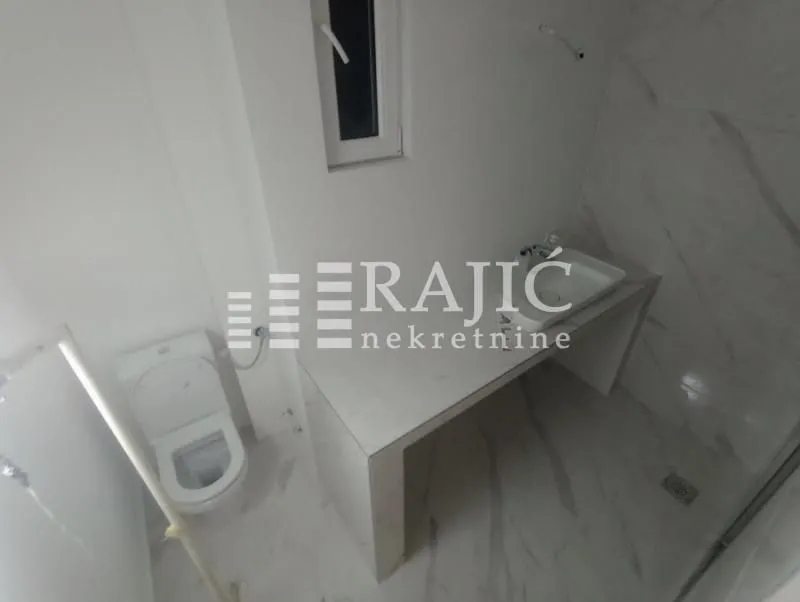 Newly equipped bathroom with a sink and toilet.