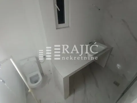 Newly equipped bathroom with a sink and toilet. - image 7