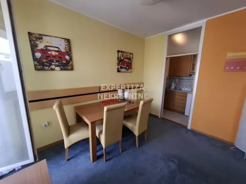 Living room with dining area and view of the kitchen. - image 6