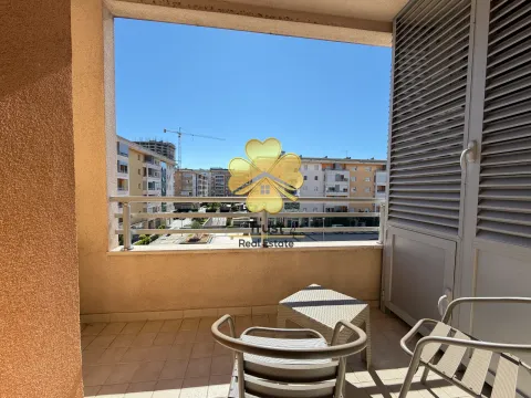 Furnished balcony with seating and a view of the neighborhood. - image 10