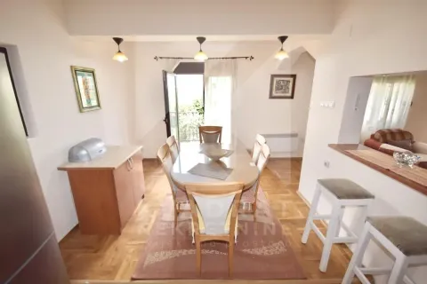 Dining area with a table and chairs, connected to the living room. - image 5