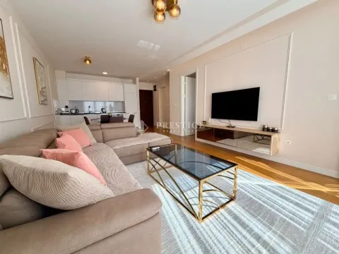 Modern and bright living room connected to the dining area and kitchen. - image 2