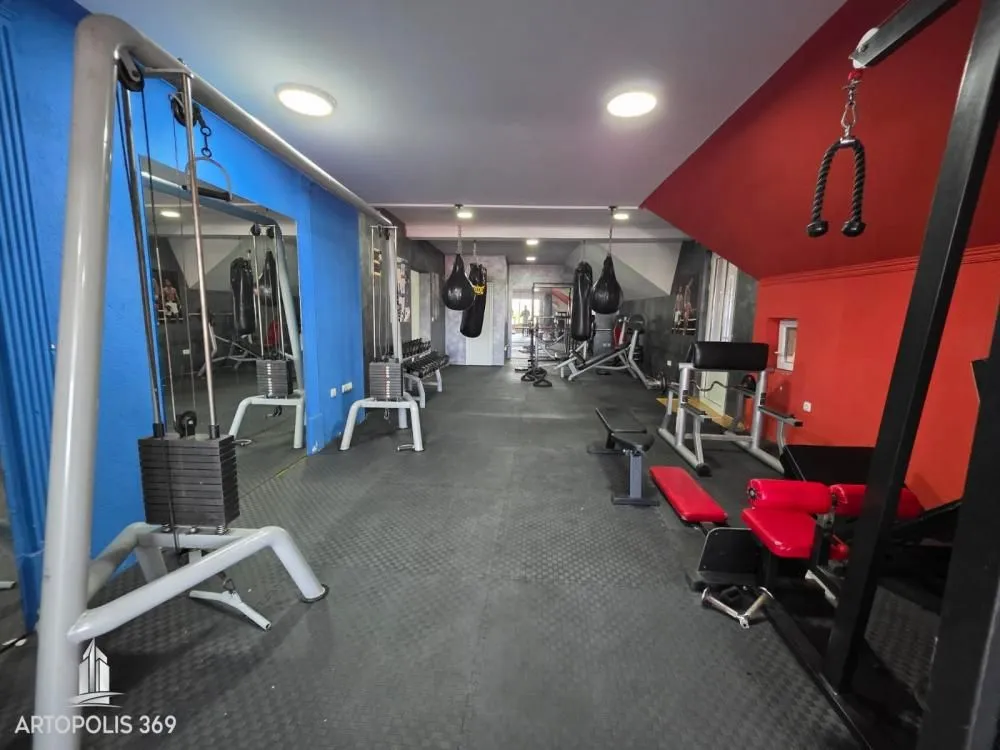 Interior of the gym with exercise machines and equipment.